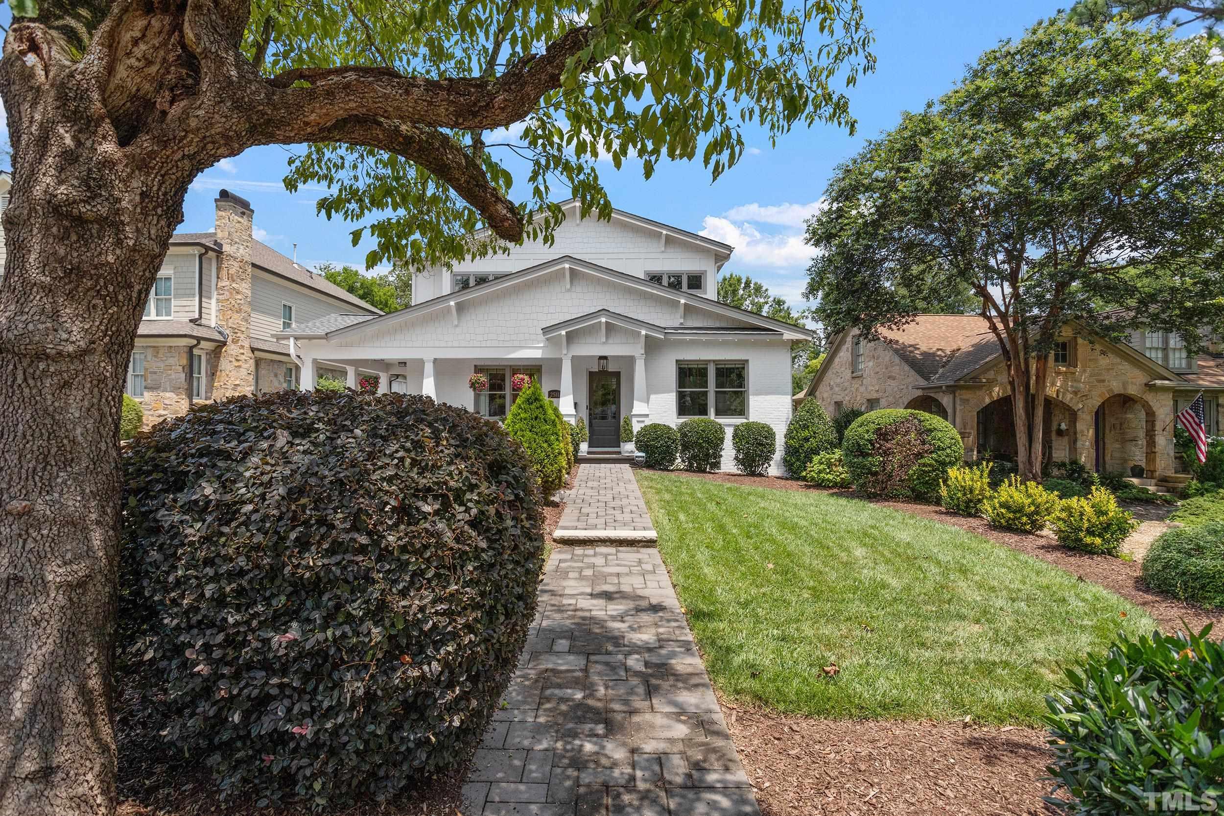 2511 Beechridge Road Raleigh, NC 27608 - Photo 2 of 45 a front view of a house with a garden