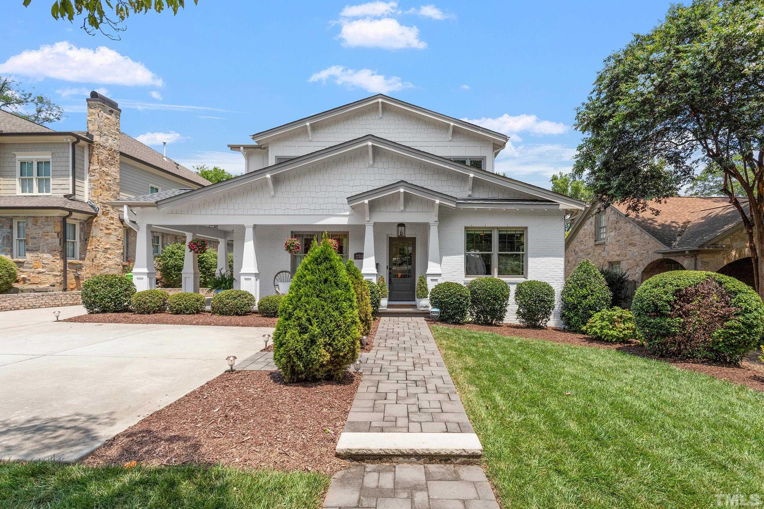 2511 Beechridge Road Raleigh, NC 27608 - Photo 3 of 45 a front view of a house with a yard and potted plants