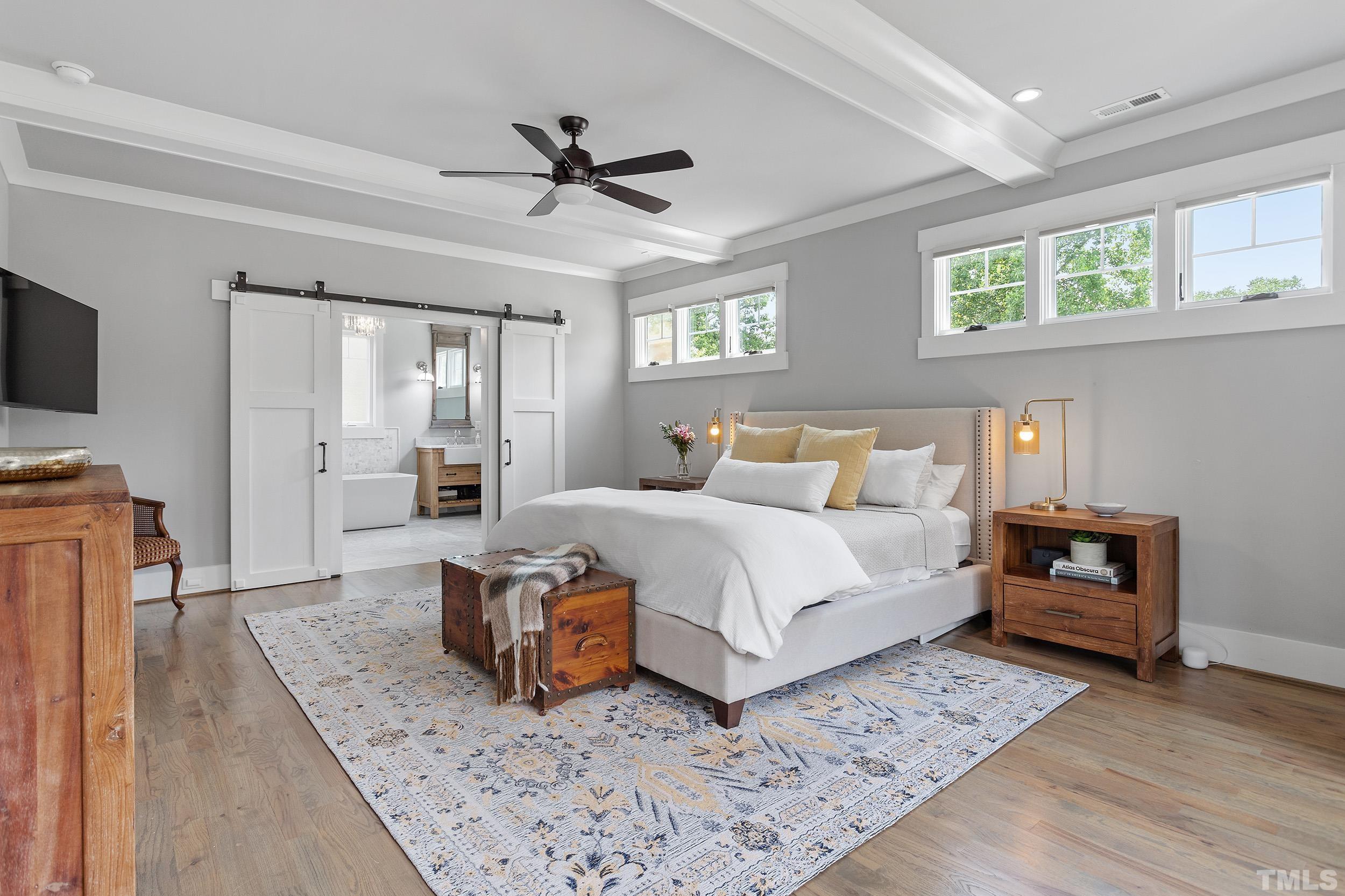 2511 Beechridge Road Raleigh, NC 27608 - Photo 32 of 45 a bedroom with a bed and wooden floor