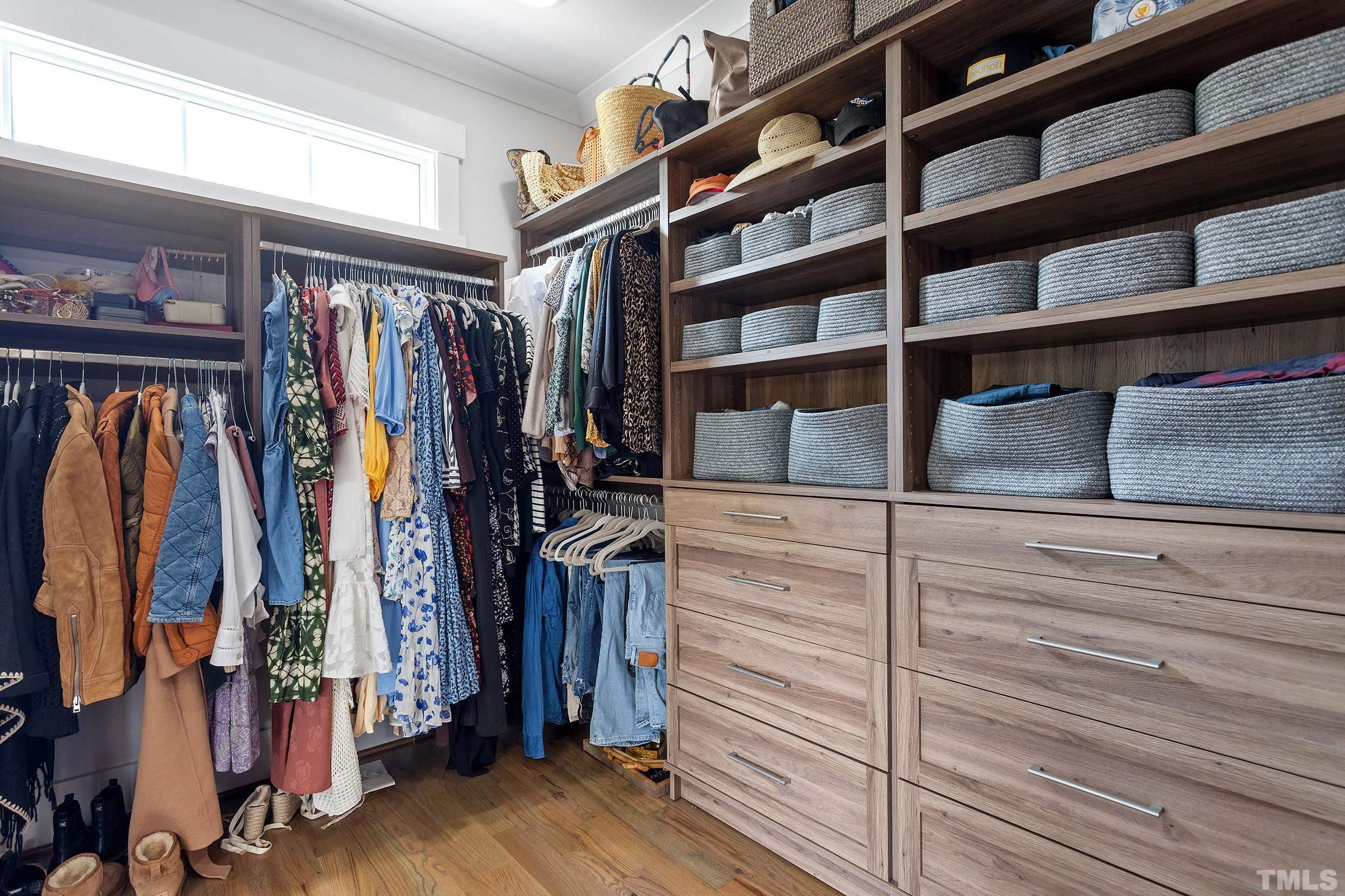 2511 Beechridge Road Raleigh, NC 27608 - Photo 36 of 45 a view of walk in closet with clothes and shoes