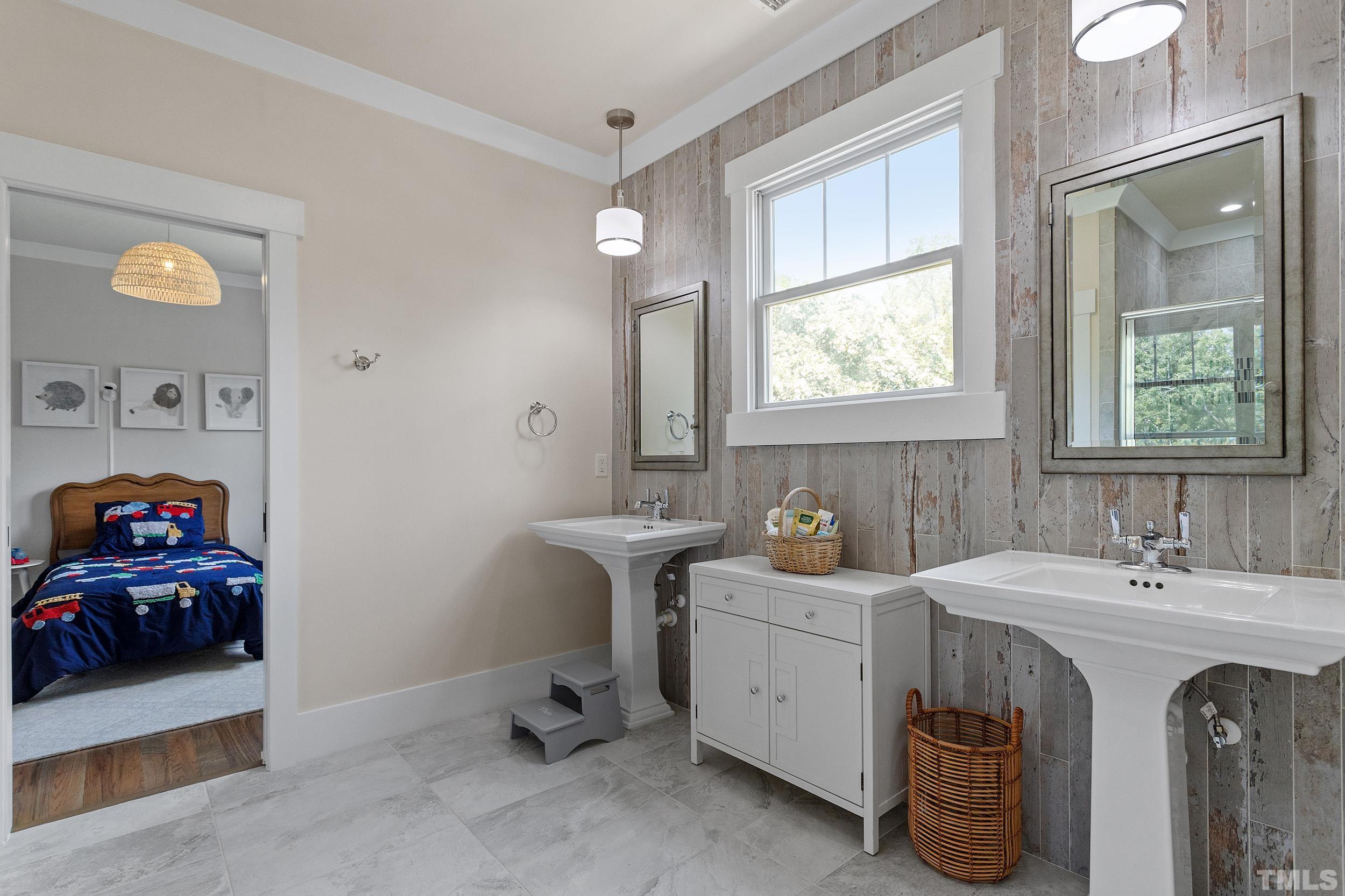 2511 Beechridge Road Raleigh, NC 27608 - Photo 38 of 45 a bathroom with a sink and a window
