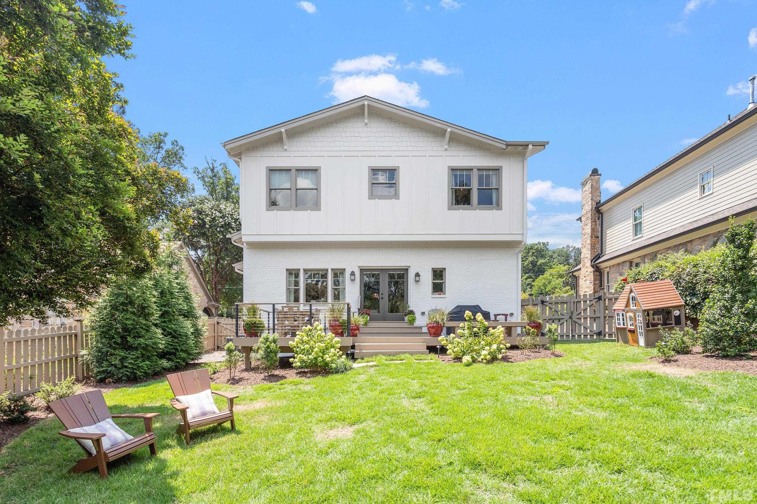 2511 Beechridge Road Raleigh, NC 27608 - Photo 42 of 45 a front view of house with yard and outdoor seating