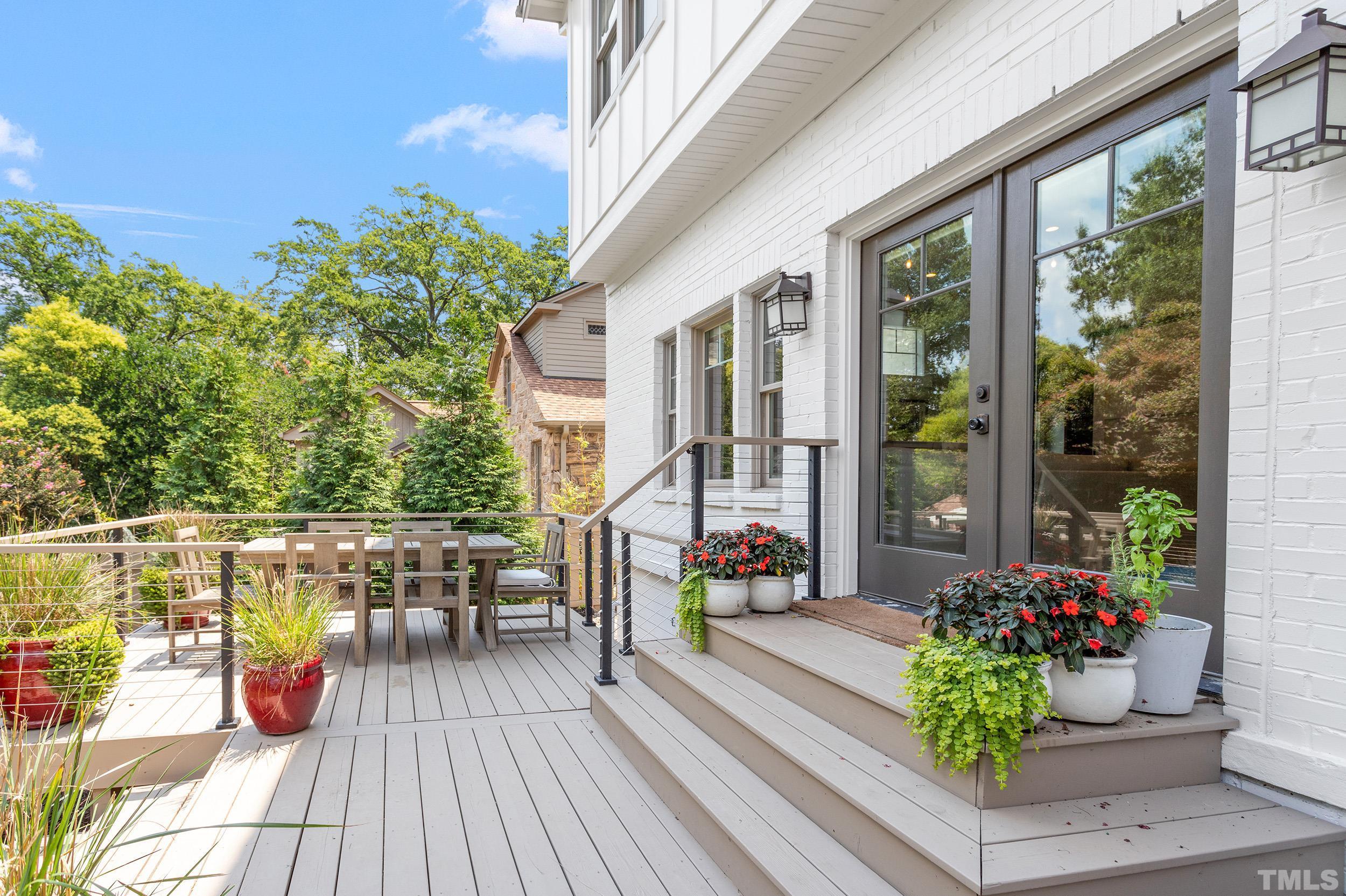 2511 Beechridge Road Raleigh, NC 27608 - Photo 43 of 45 a view of a balcony with chairs and potted plants