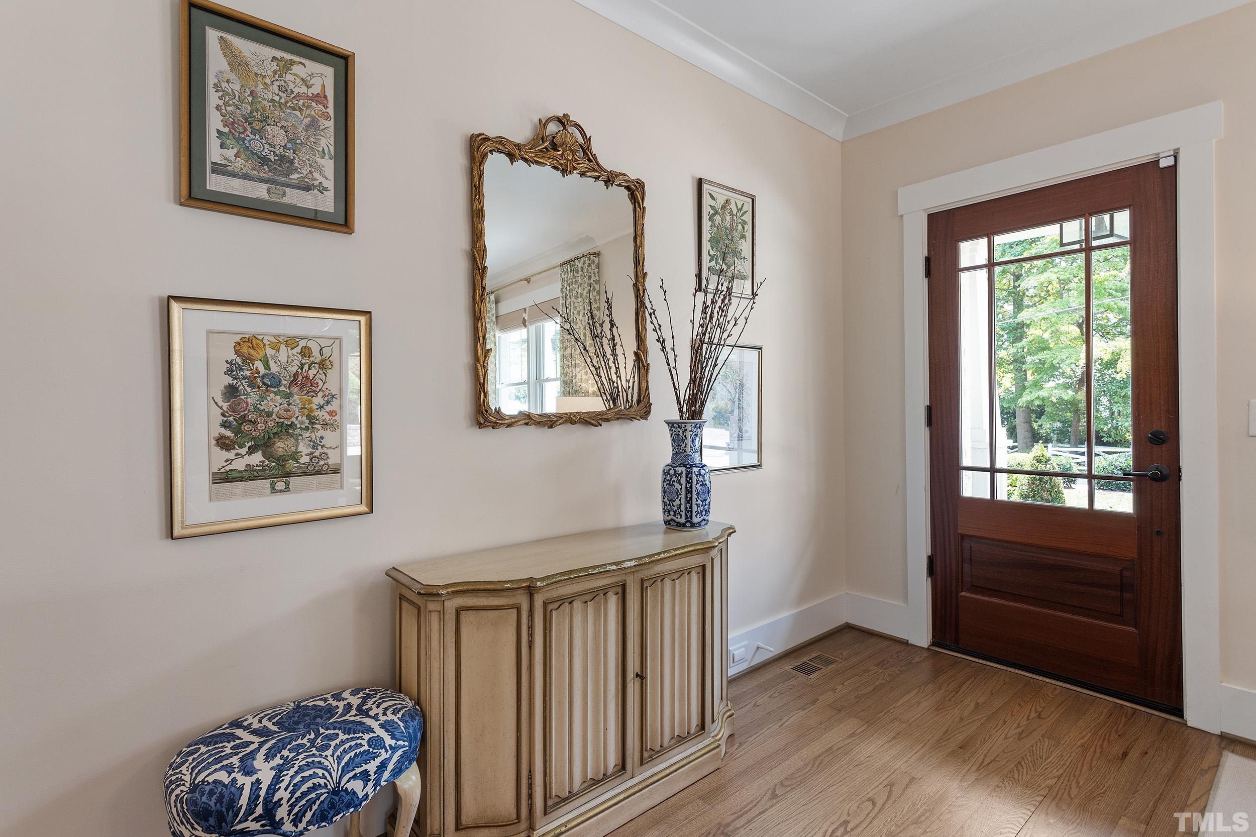2511 Beechridge Road Raleigh, NC 27608 - Photo 7 of 45 a view of room with window and wooden floor