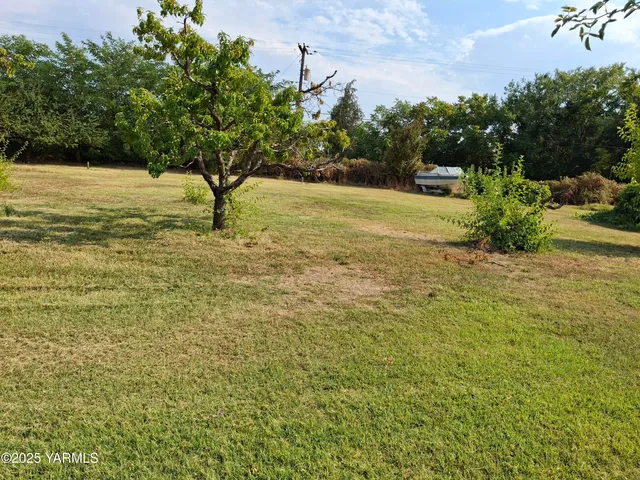 a view of a lake with a yard