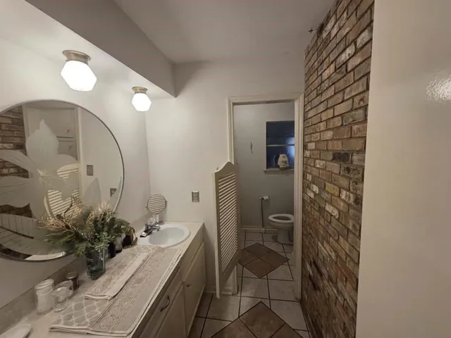 a bathroom with a sink and mirror