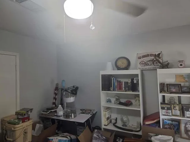 a view of a workspace with furniture