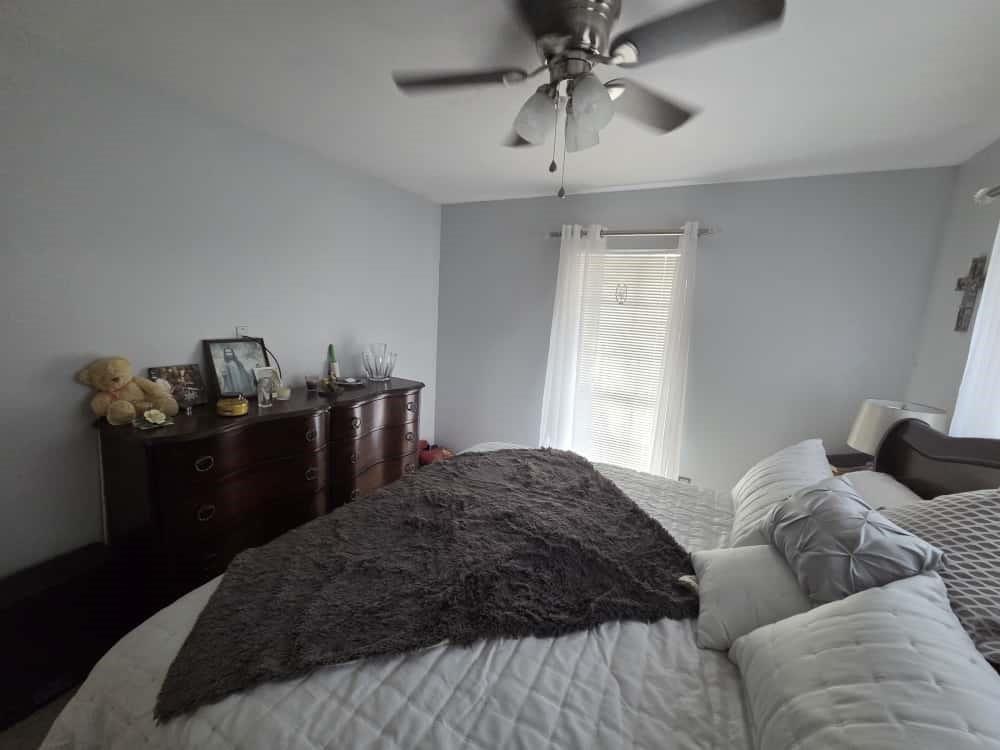 252 Parkside Loop Brookeland, TX 75931 - Photo 9 of 22 a bedroom with a bed and wooden floor