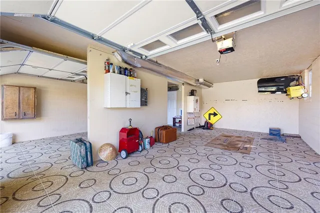 a bedroom with a bed dresser and a window