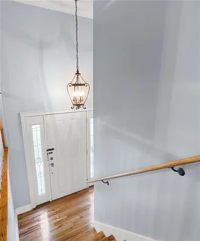 a view of a room with wooden floor