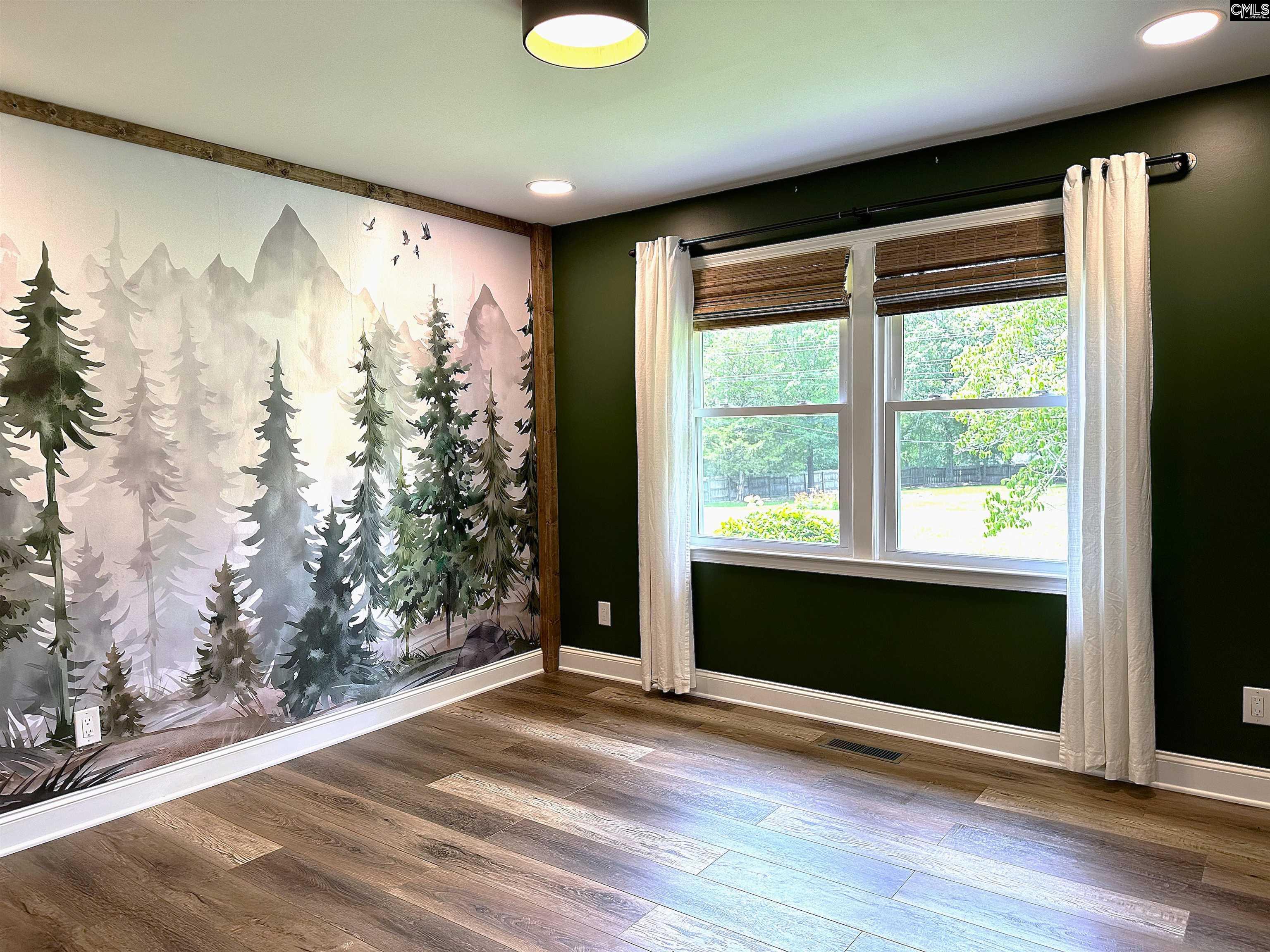535 Sandbar Road Chapin, SC 29036 - Photo 21 of 23 a view of empty room with wooden floor and fan