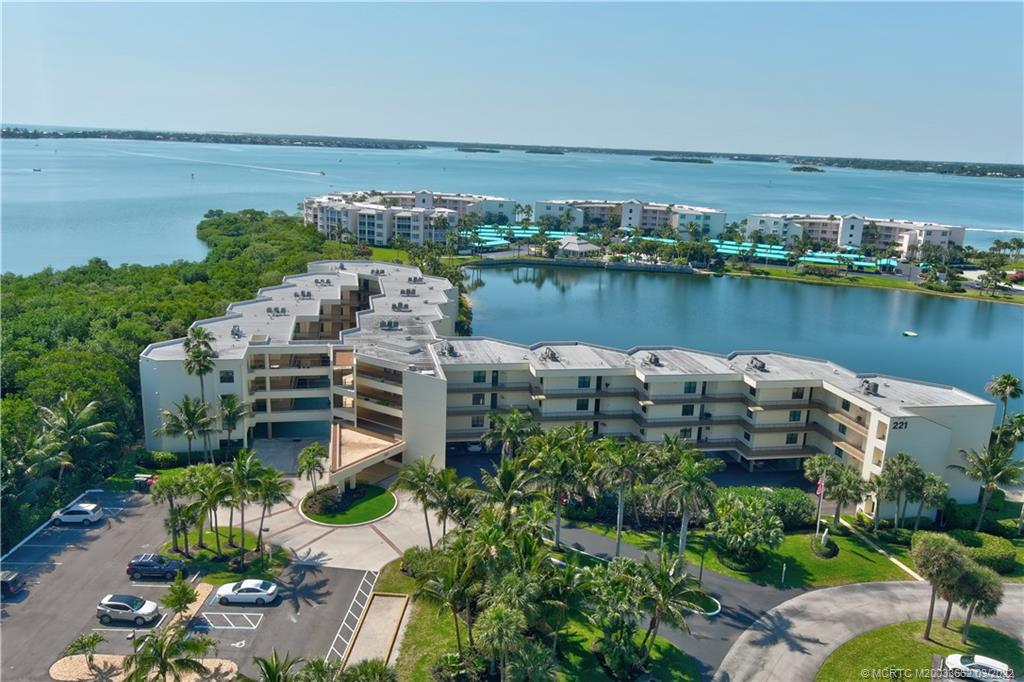 an aerial view of a house with a lake view