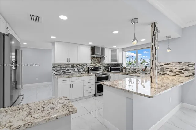 a kitchen with a refrigerator and a sink