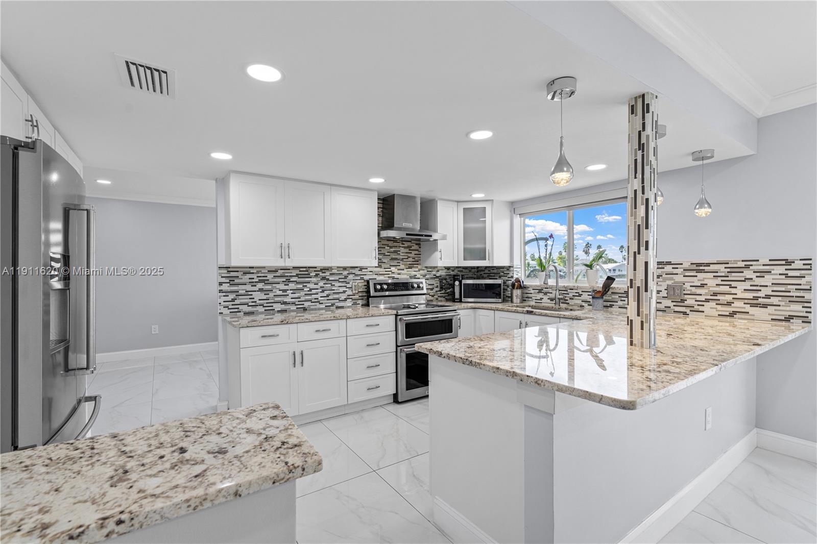 5262 Southwest 153rd Court Miami, FL 33185 - Photo 11 of 47 a kitchen with a refrigerator and a sink
