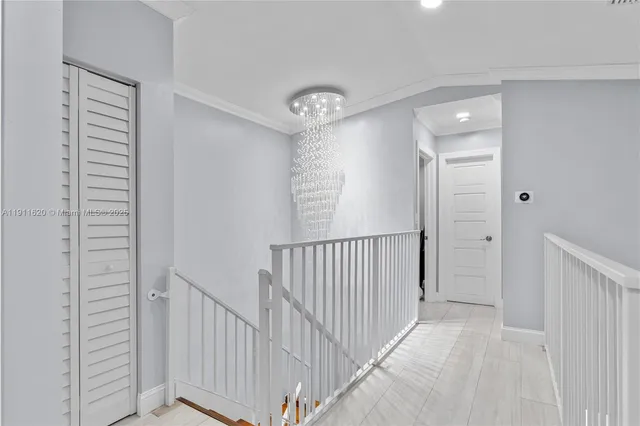 a view of a hallway with entryway door
