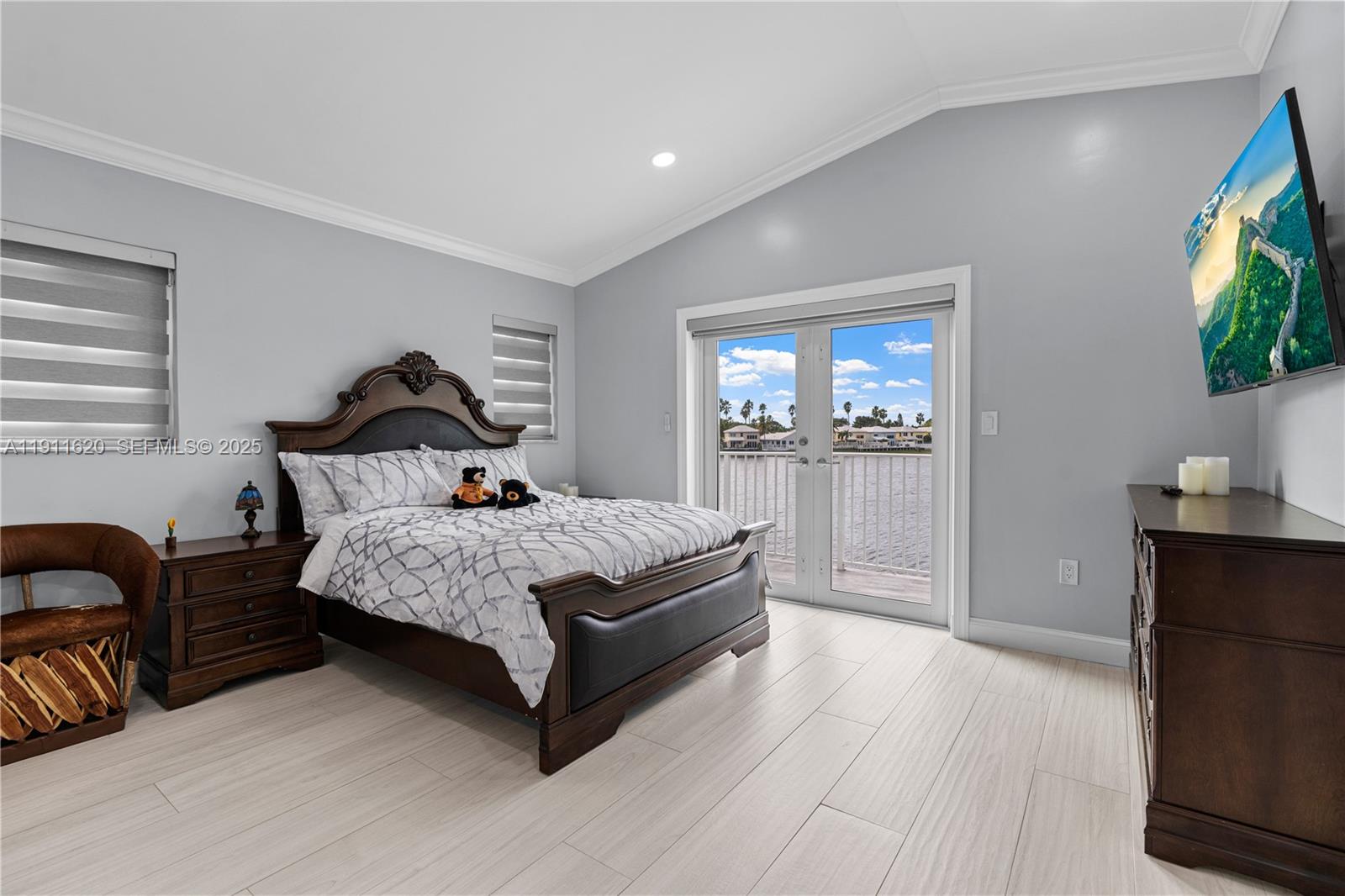 5262 Southwest 153rd Court Miami, FL 33185 - Photo 17 of 47 a bedroom with a bed and a flat screen television