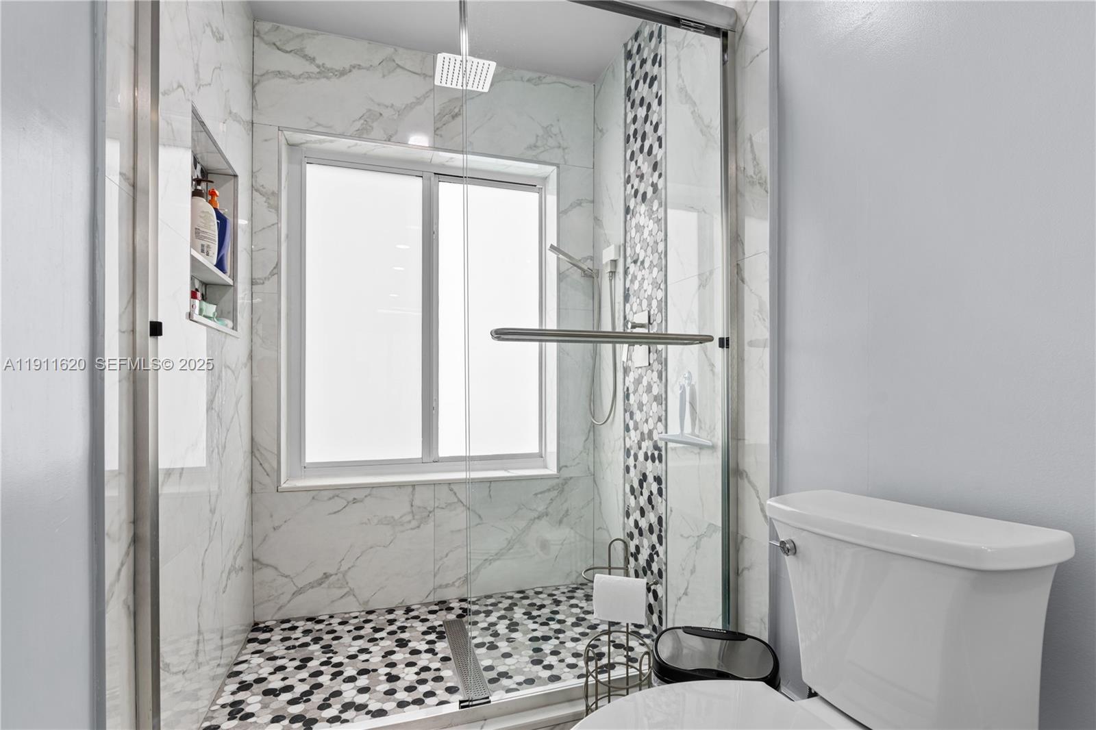 5262 Southwest 153rd Court Miami, FL 33185 - Photo 22 of 47 a bathroom with a toilet a window and shower