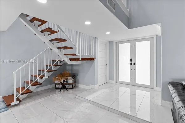 a view of an entryway with stairs
