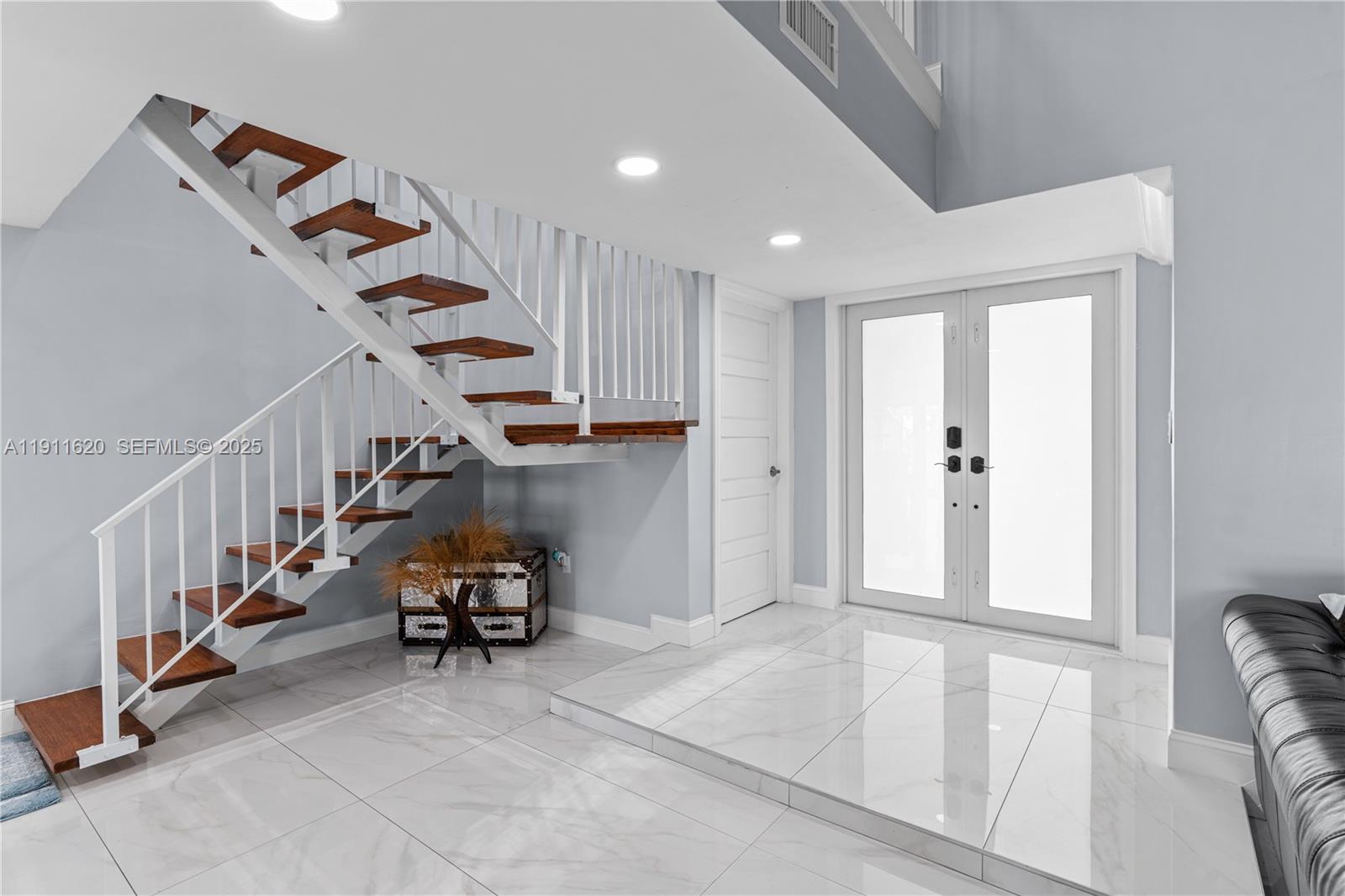 5262 Southwest 153rd Court Miami, FL 33185 - Photo 3 of 47 a view of an entryway with stairs