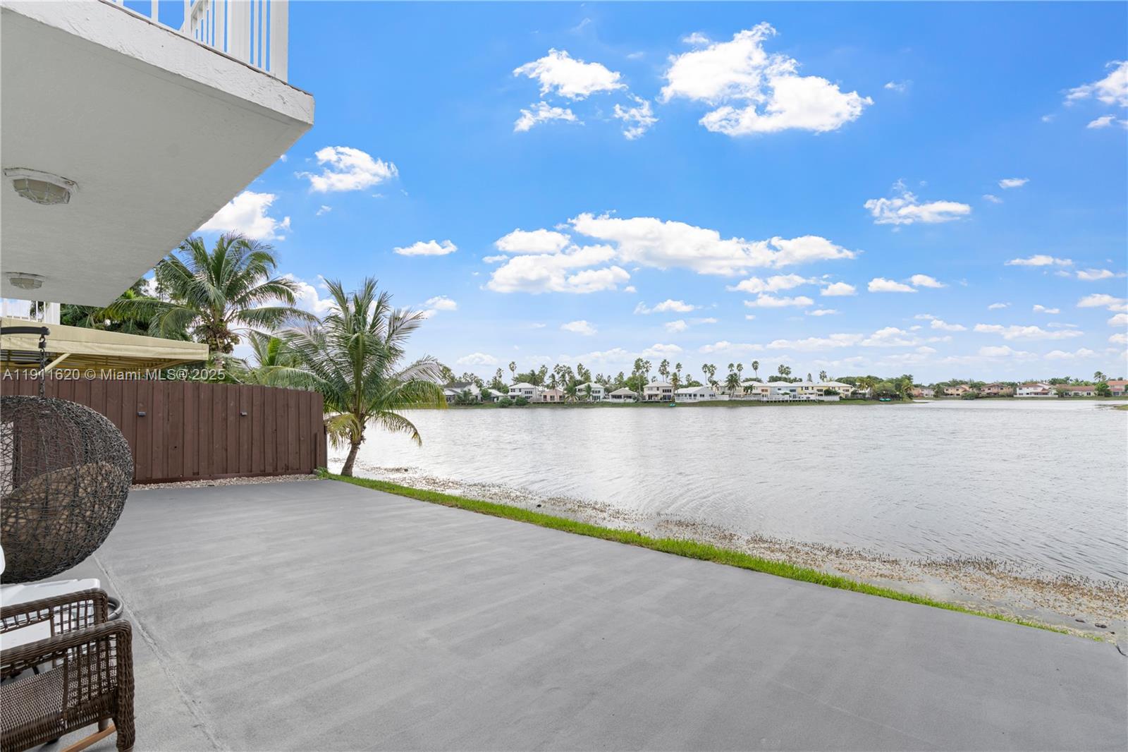 5262 Southwest 153rd Court Miami, FL 33185 - Photo 32 of 47 a view of a house with pool and lake view