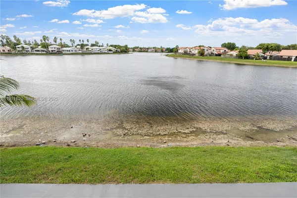 a view of a lake with a city
