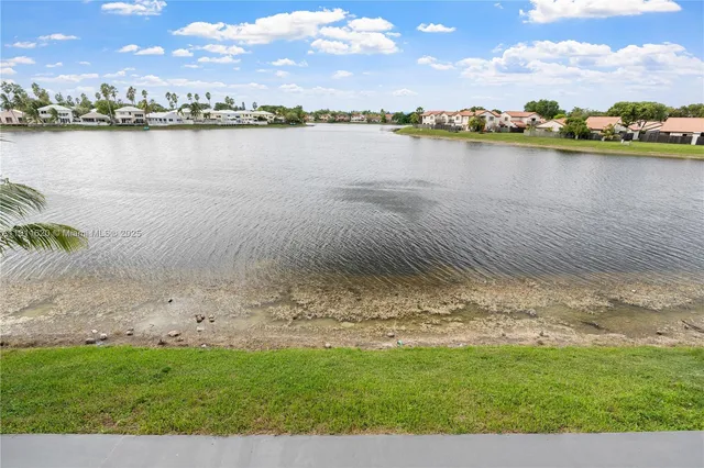 a view of a lake with a city