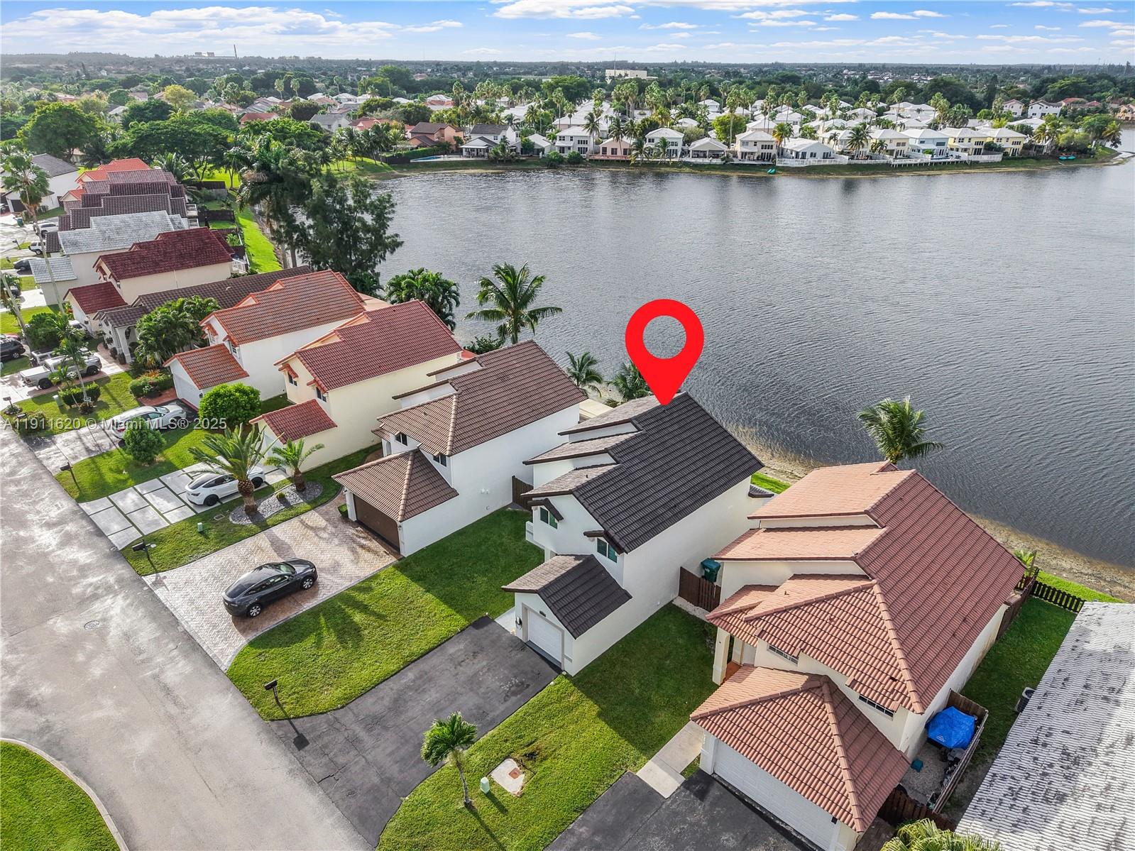 5262 Southwest 153rd Court Miami, FL 33185 - Photo 37 of 47 an aerial view of a house with a lake view