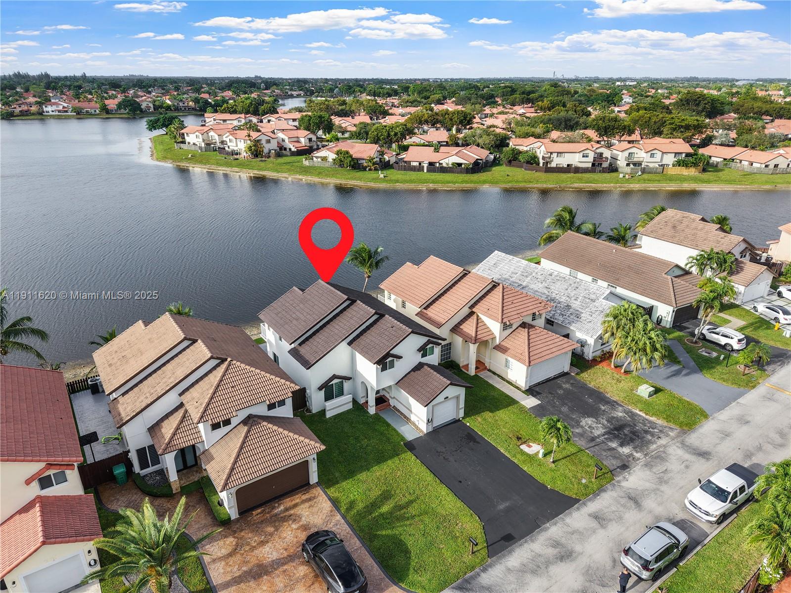 5262 Southwest 153rd Court Miami, FL 33185 - Photo 38 of 47 an aerial view of a house with a lake view