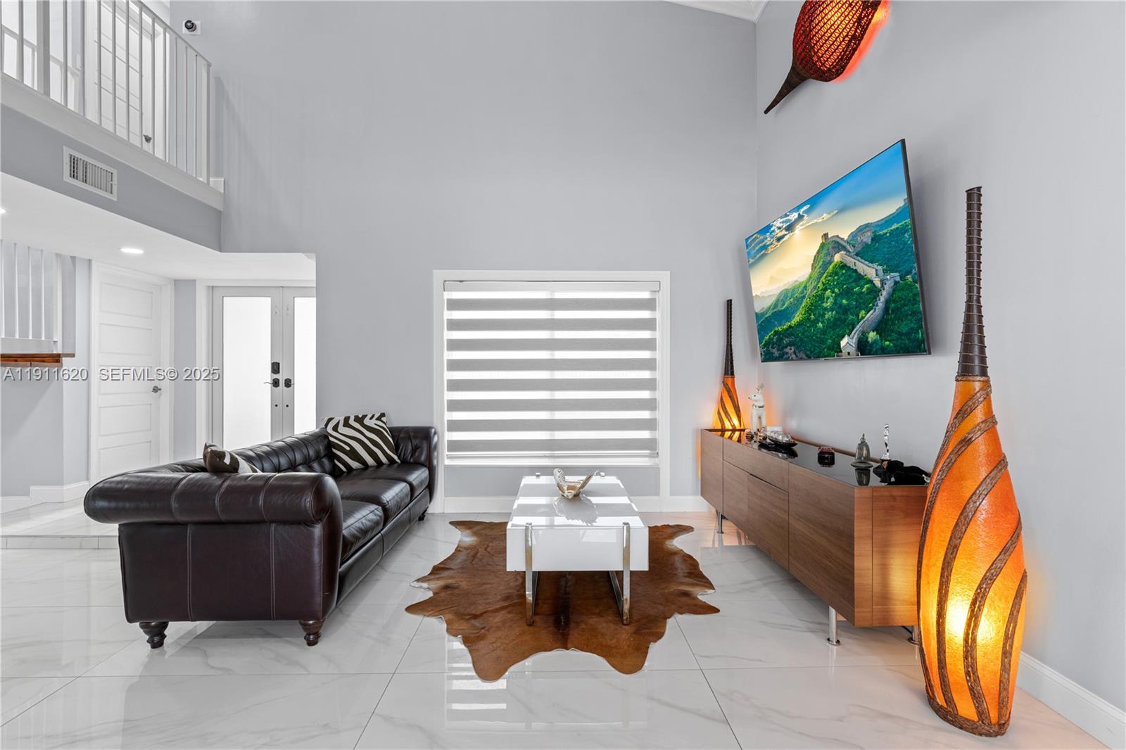 5262 Southwest 153rd Court Miami, FL 33185 - Photo 6 of 47 a living room with furniture and a flat screen tv