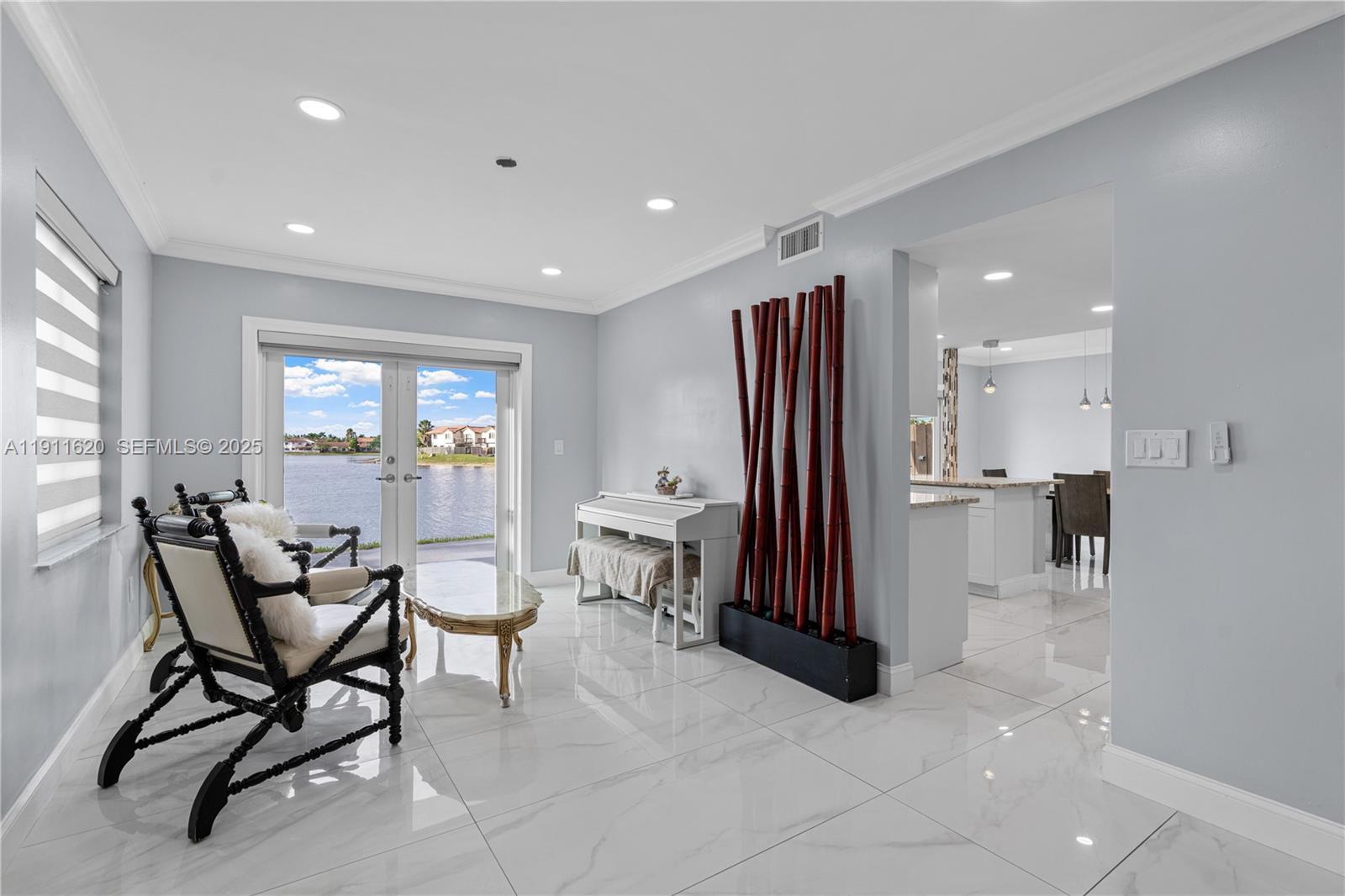 5262 Southwest 153rd Court Miami, FL 33185 - Photo 8 of 47 a living room with furniture a large window and stainless steel appliances