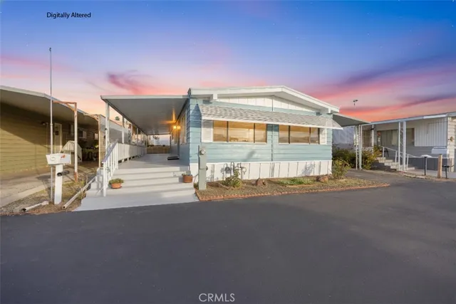 a front view of a house with a street