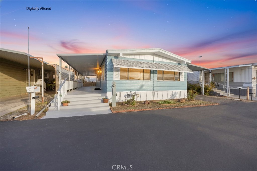a front view of a house with a street