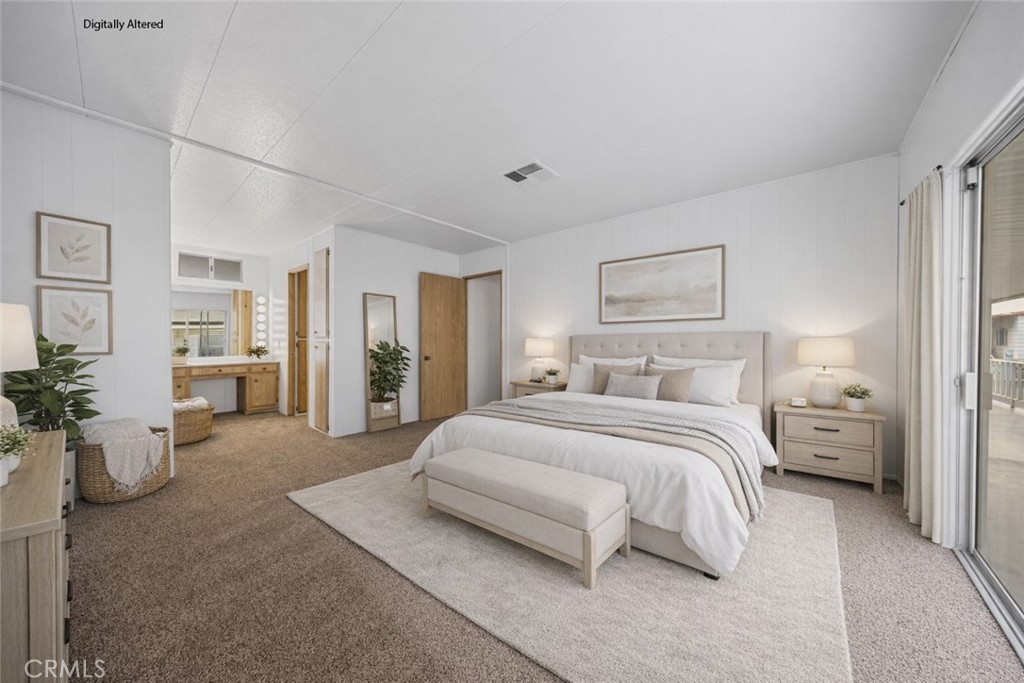 950 California Street, Unit 82 Calimesa, CA 92320 - Photo 13 of 49 a spacious bedroom with a bed and a large mirror