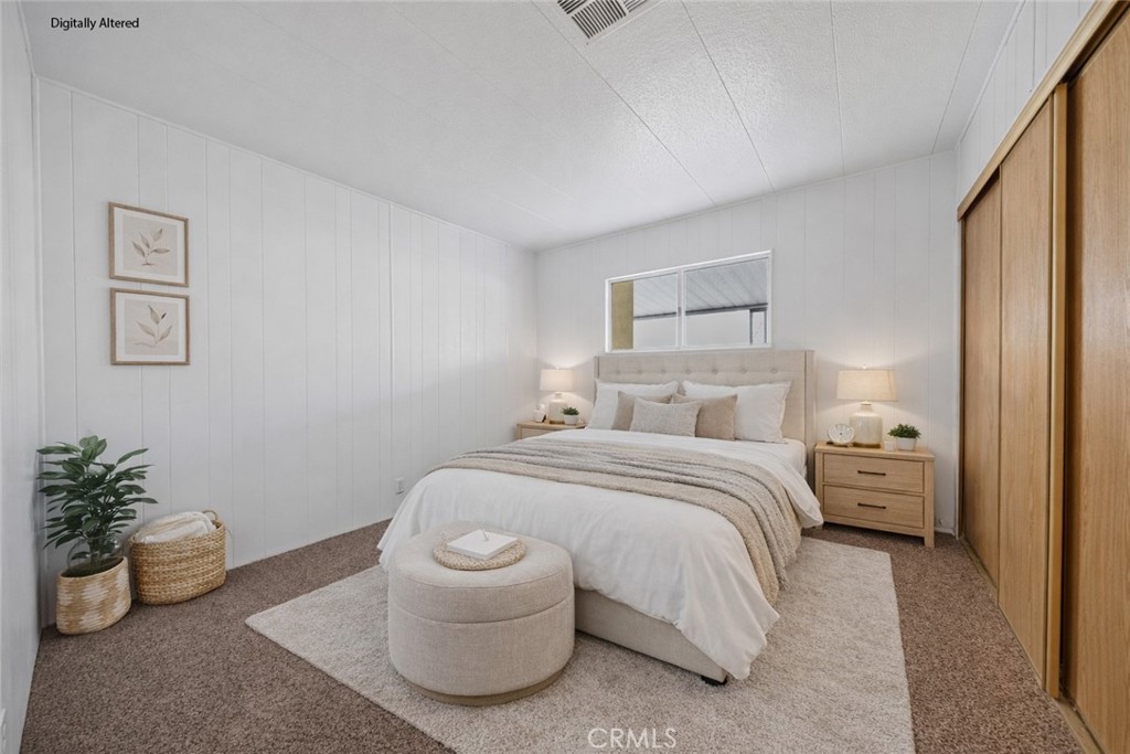950 California Street, Unit 82 Calimesa, CA 92320 - Photo 15 of 49 a spacious bedroom with a bed and a potted plant