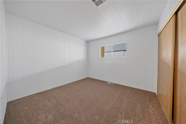 a large bathroom with a large mirror vanity and shower