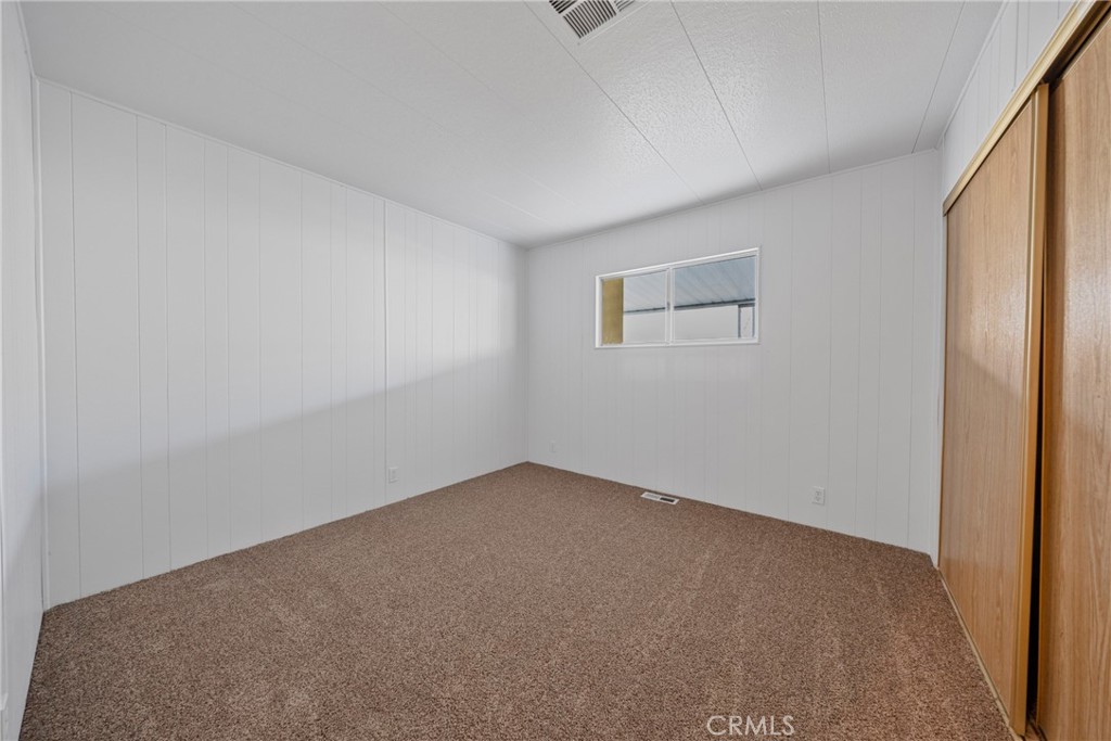 950 California Street, Unit 82 Calimesa, CA 92320 - Photo 16 of 49 an empty room with a window