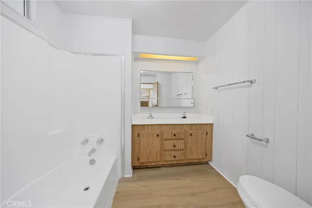 a bathroom with a tub and shower