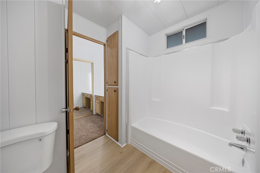 950 California Street, Unit 82 Calimesa, CA 92320 - Photo 19 of 49 a bathroom with a tub and shower