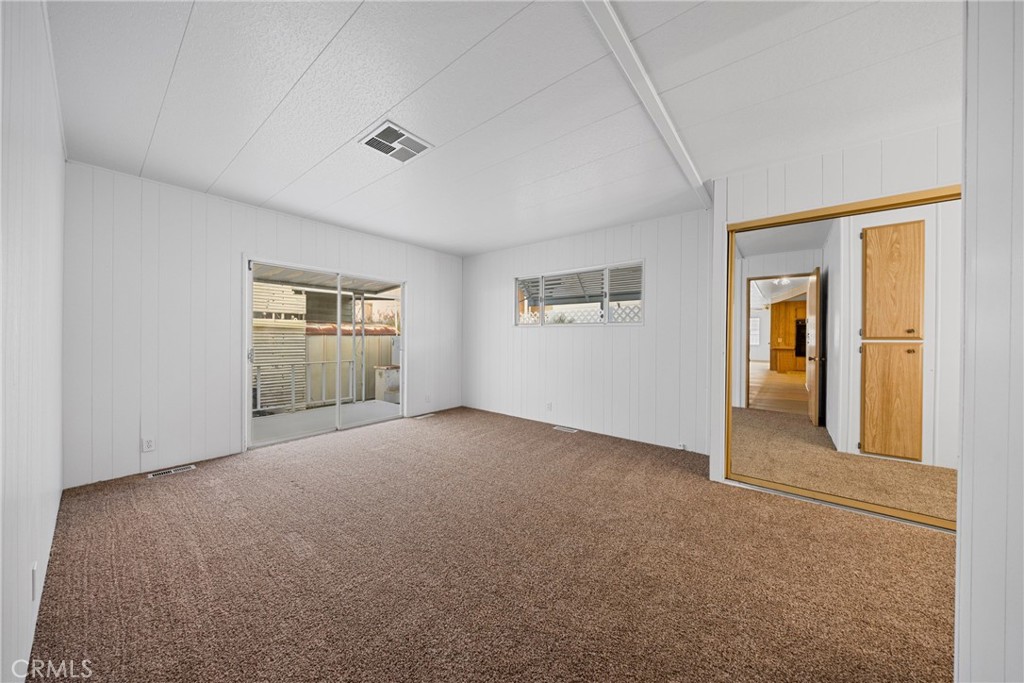 950 California Street, Unit 82 Calimesa, CA 92320 - Photo 21 of 49 an empty room with windows and closet