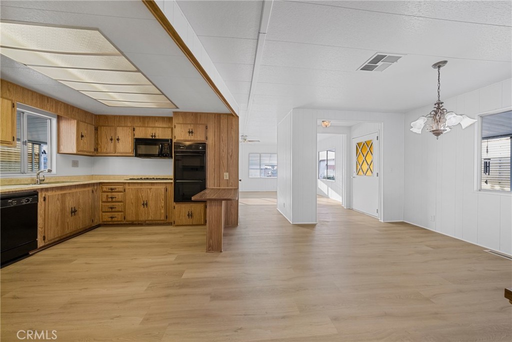 950 California Street, Unit 82 Calimesa, CA 92320 - Photo 26 of 49 a kitchen with stainless steel appliances granite countertop a sink a stove and cabinets