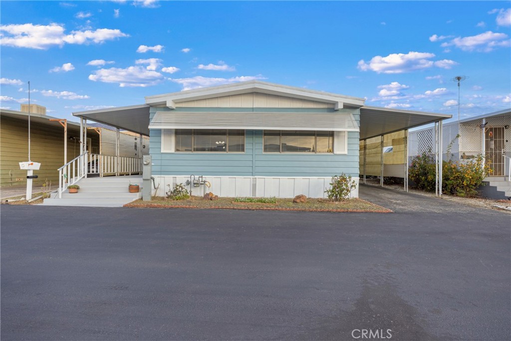 950 California Street, Unit 82 Calimesa, CA 92320 - Photo 39 of 49 a view of a house with a patio