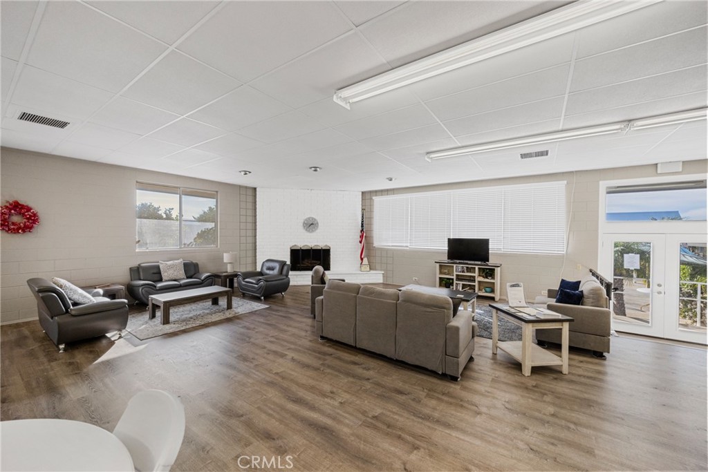 950 California Street, Unit 82 Calimesa, CA 92320 - Photo 45 of 49 a living room with furniture and a wooden floor