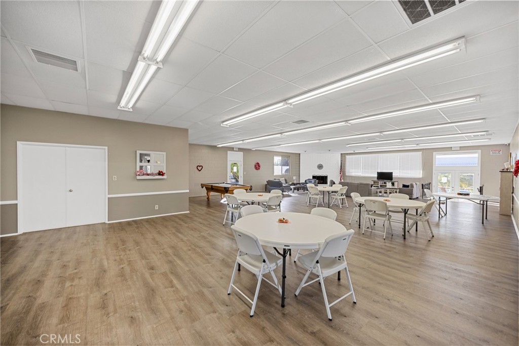 950 California Street, Unit 82 Calimesa, CA 92320 - Photo 47 of 49 a view of a dining room with furniture and wooden floor