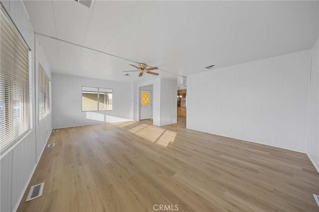 950 California Street, Unit 82 Calimesa, CA 92320 - Photo 10 of 49 a view of empty room with wooden floor and fan