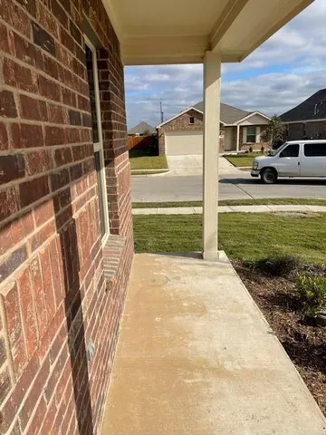 a view of a patio with a yard