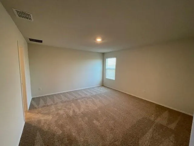 a view of an empty room and window