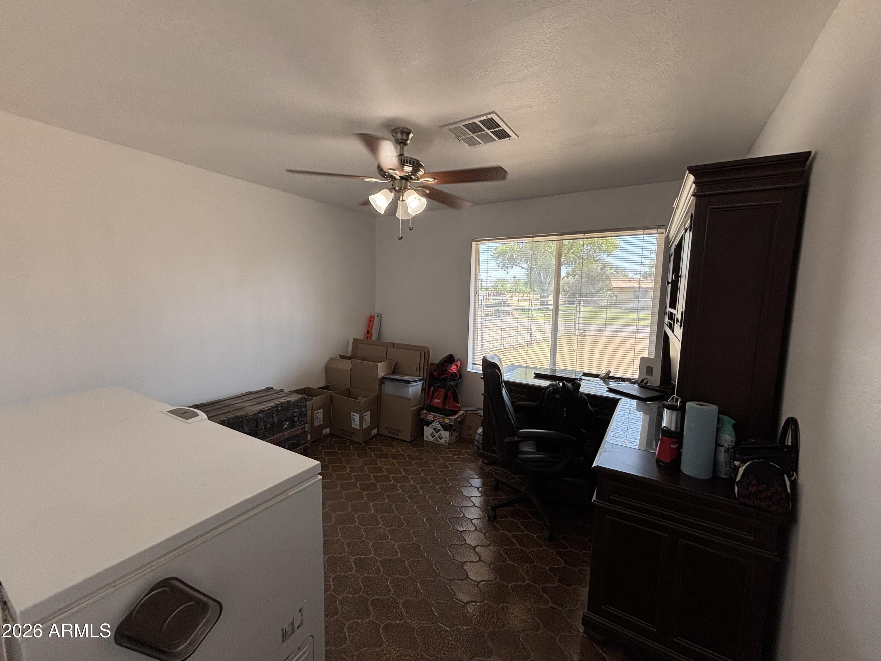 6508 West Fremont Road Laveen, AZ 85339 - Photo 20 of 32 a living room with furniture and a large window