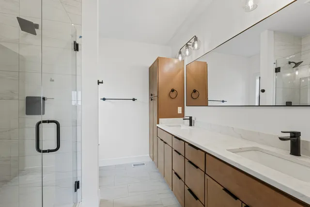 a bathroom with a sink and mirror