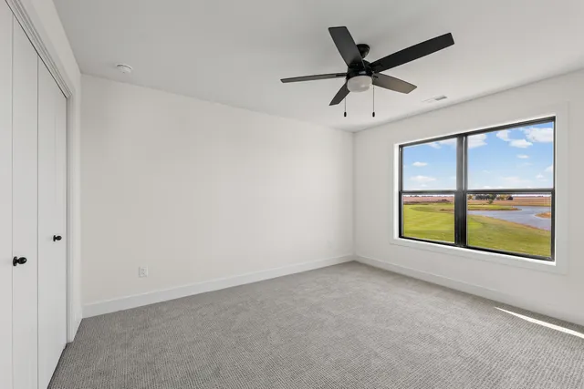 a view of a livingroom with a ceiling fan