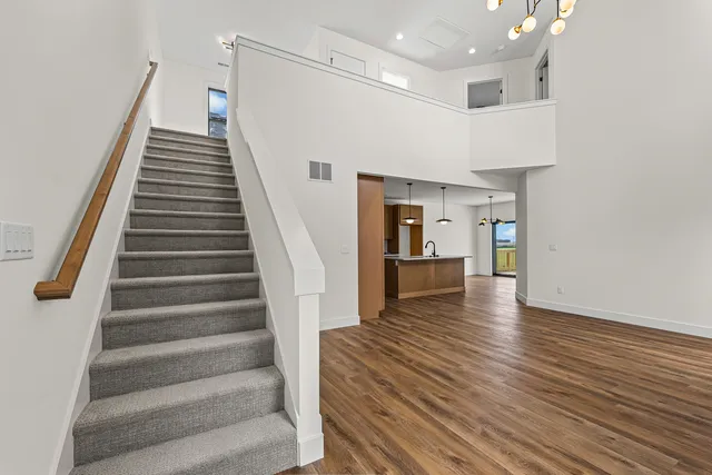 a view of an entryway with wooden floor